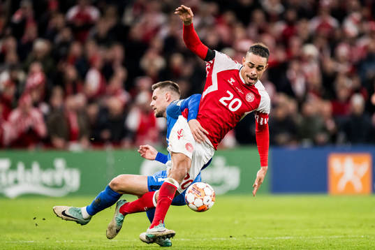 Yussuf Poulsen of Denmark and Timi Elsnik of Slovenia