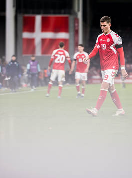 Jonas Wind of Denmark looks dejected