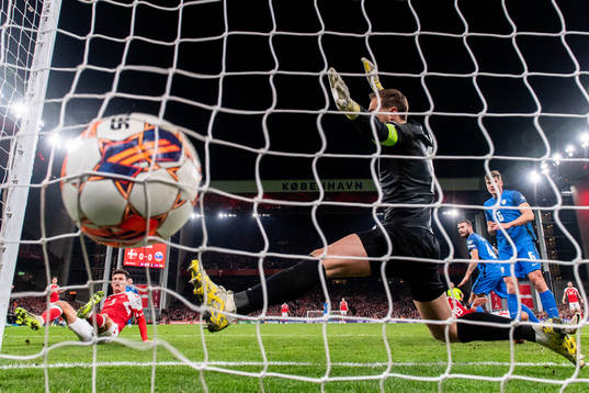 Joakim Mæhle of Denmark scores the 1-0 goal against