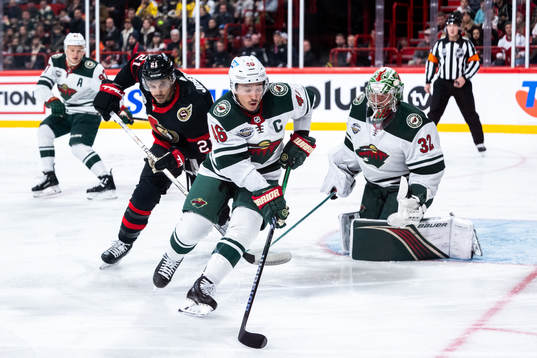 Jared Spurgeon of Minnesota Wild and Mathieu Joseph of