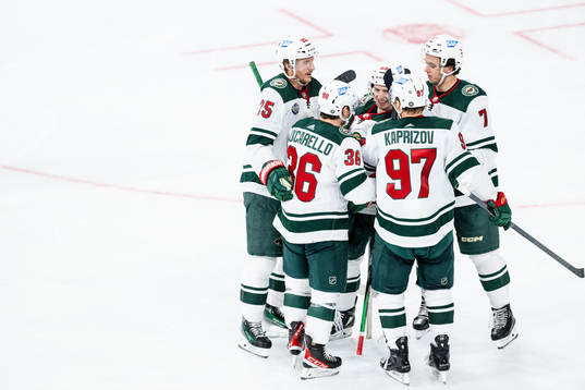 Marco Rossi of Minnesota Wild celebrates with teammates