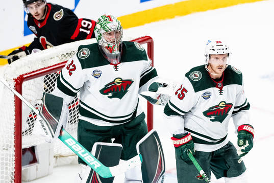 Goaltender Filip Gustavsson and Jonas Brodin of Minnesota
