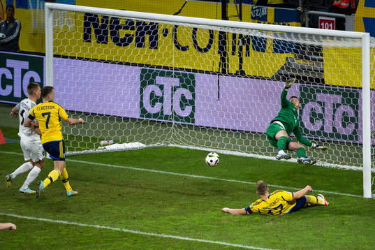 Viktor Claesson of Sweden and goalkeeper Karl Jakob Hein of