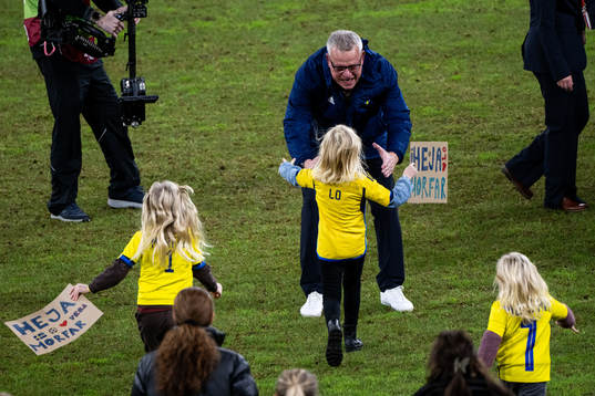 Head coach Janne Andersson of Sweden with his grandchild