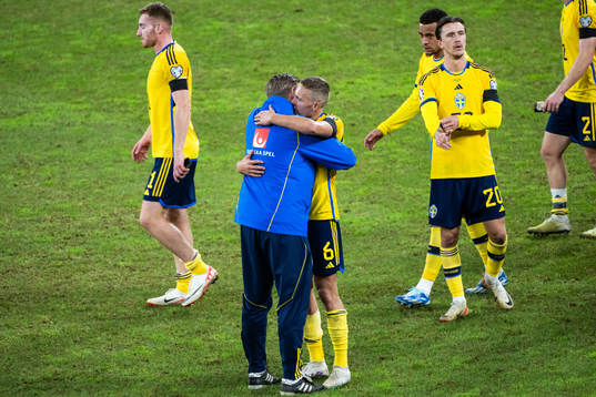 Assistant coach Peter Wettergren and Ludwig Augustinsson of