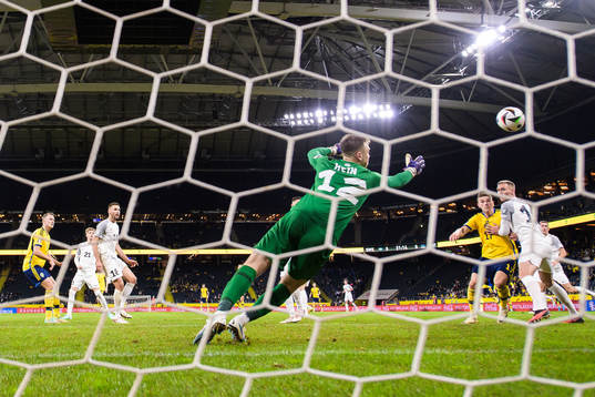Viktor Claesson of Sweden scores the 1-0 goal behind