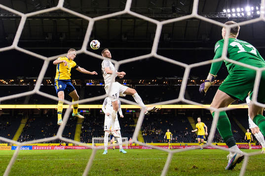 Viktor Claesson of Sweden scores the 1-0 goal behind
