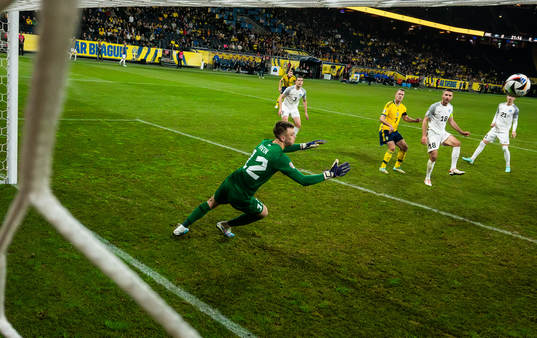 Viktor Claesson of Sweden scores the 1-0 goal behind