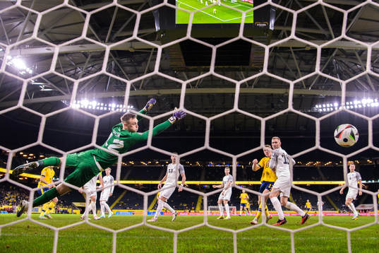Viktor Claesson of Sweden scores the 1-0 goal behind