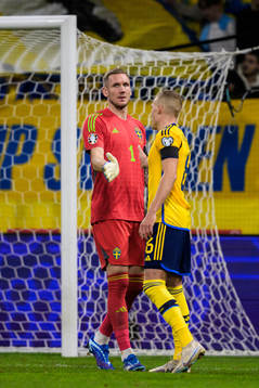 Goalkeeper Robin Olsen and Ludwig Augustinsson of Sweden