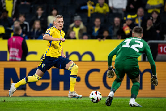 Ludwig Augustinsson of Sweden and goalkeeper Karl Jakob
