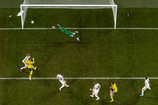 Viktor Claesson of Sweden scores the 1-0 goal behind