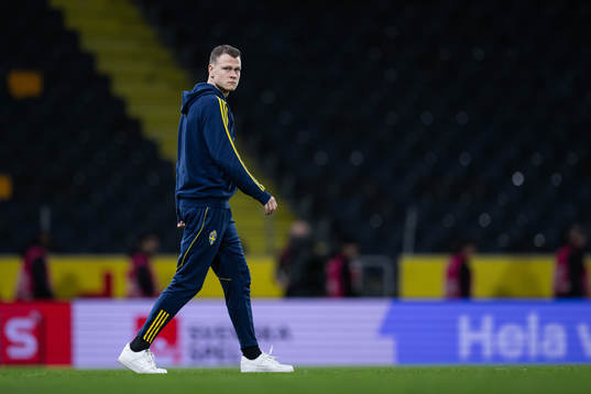 Viktor Claesson of Sweden inspect the pitch