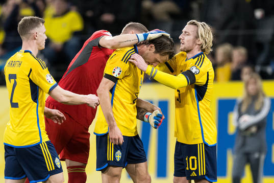 Goalkeeper Robin Olsen, Albin Ekdal, and Emil Forsberg of