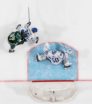 Jon Merrill of Minnesota Wild, not pictured, scores the 0-1