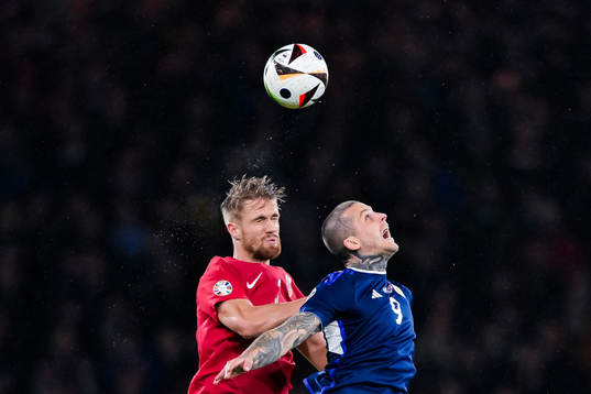 Kristoffer Ajer of Norway and Lyndon Dykes of Scotland