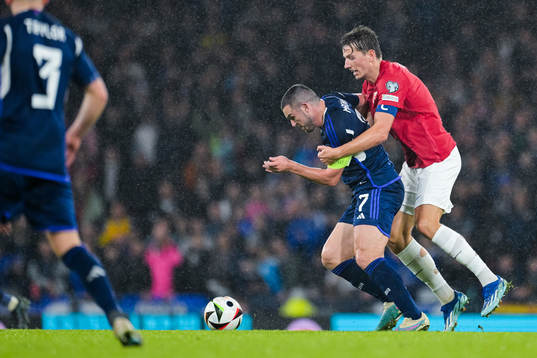 John McGinn of Scotland and Sander Berge of Norway