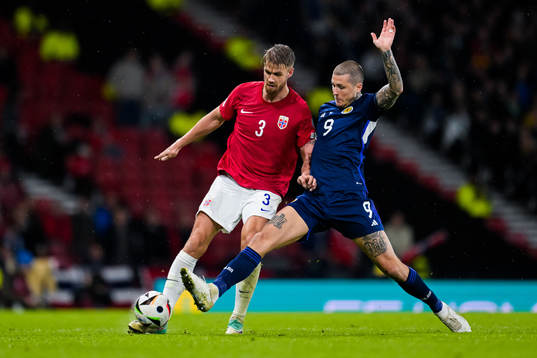 Kristoffer Ajer of Norway and Lyndon Dykes of Scotland