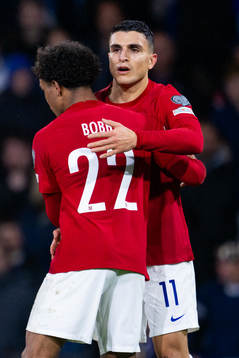 Mohamed Elyounoussi of Norway celebrates with teammate