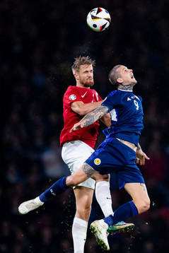 Kristoffer Ajer of Norway and Lyndon Dykes of Scotland