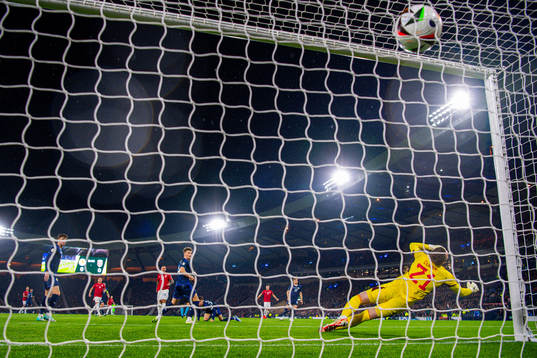 Aron Dønnum of Norway scores the 0-1 goal past goalkeeper