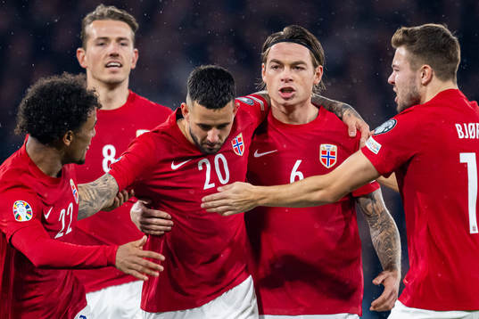 Aron Dønnum of Norway celebrates with Patrick Berg and