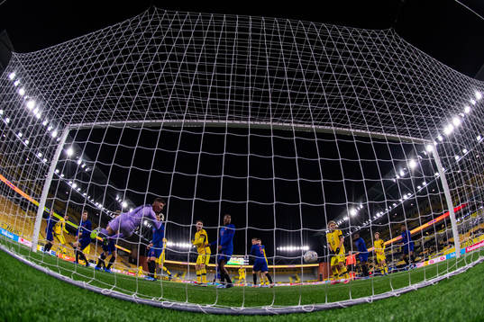 Joakim Persson of Sweden scores 2-3 behind goalkeeper
