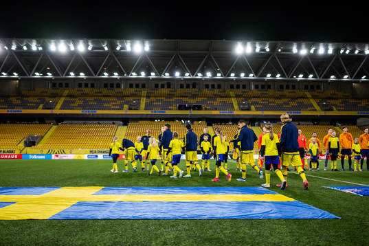 Players of Sweden enter the pitch