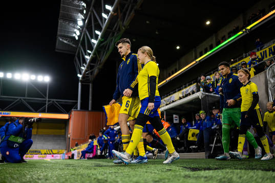 Armin Gigovic and goalkeeper Oliver Dovin of Sweden enter