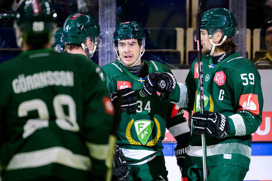 Michael Lindqvist of Färjestad celebrates with team mates