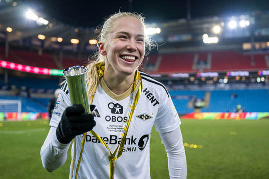 Emilie Nautnes of Rosenborg celebrates with the trophy