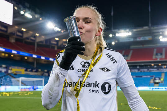 Emilie Nautnes of Rosenborg celebrates with the trophy