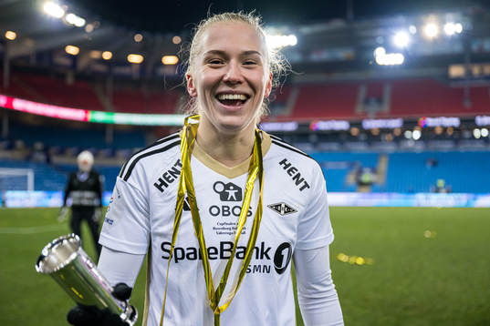 Emilie Nautnes of Rosenborg celebrates with the trophy