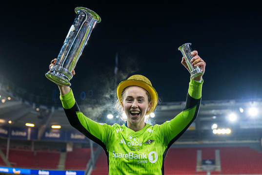 Karen Oline Sneve of Rosenborg celebrates with the trophy