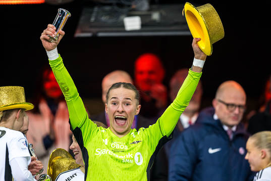 Rugile Rulyte of Rosenborg celebrates with the trophy