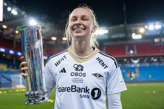 Emilie Marie Joramo of Rosenborg celebrates with the trophy