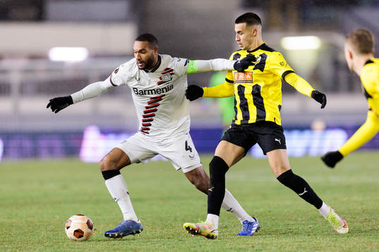 Jonathan Tah of Bayer Leverkusen and Srdjan Hrstic of BK