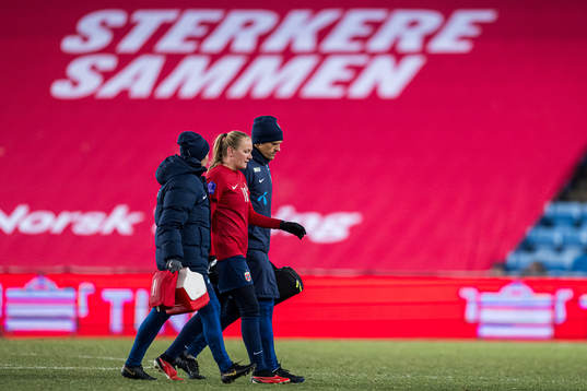 Frida Maanum of Norway leaves the pitch with an injury