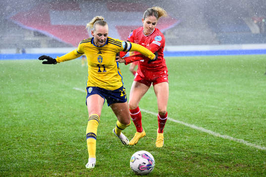 Stina Blackstenius of Sweden and Luana Buhler of Switzerland
