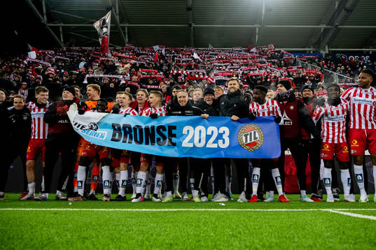 Players of Tromsø celebrate the bronze medal