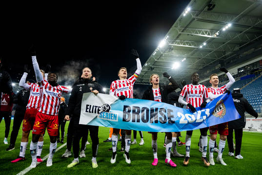 Players of Tromsø celebrate the bronze medal