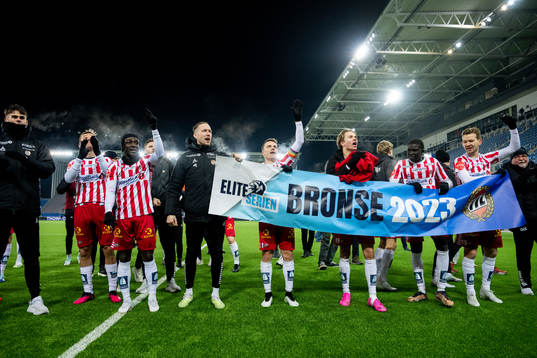 Players of Tromsø celebrate the bronze medal