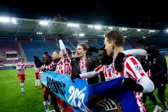 Players of Tromsø celebrate the bronze medal