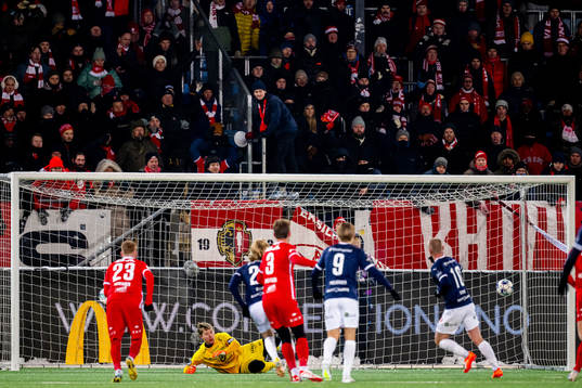 Herman Stengel of Strømsgodset scores the 3-0 goal behind
