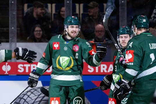 Linus Johansson of Färjestad celebrates with team mates