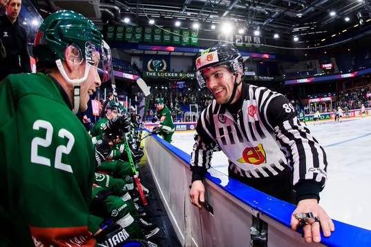 Per Åslund of Färjestad and linesman Gustav Jonsson