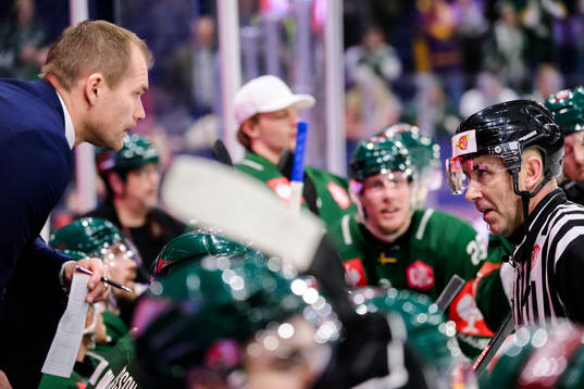 Head coach Thomas Mitell of Färjestad and referee Linus
