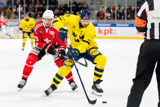 Henrik Tömmernes of Sweden in the ice hockey game between