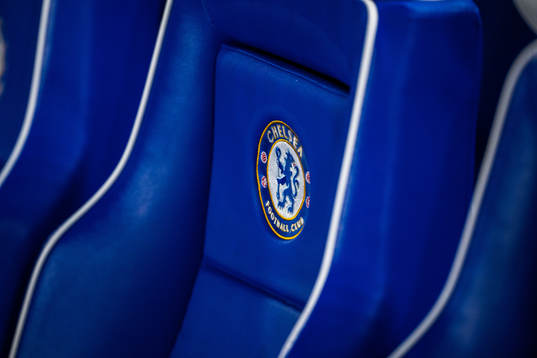 Chairs with the logo of Chelsea at the players bench