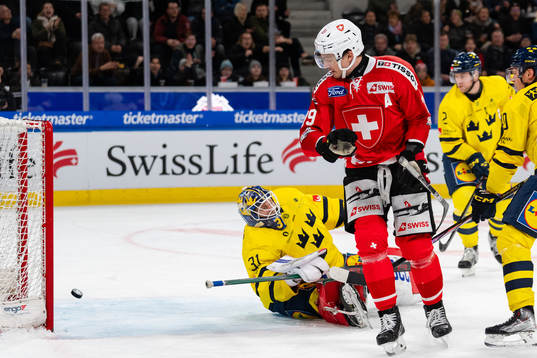 Goaltender Lars Johansson of Sweden looks dejected